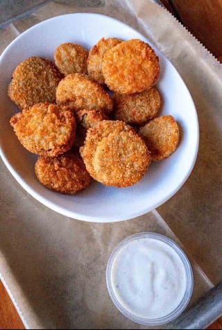 Deep Fried Pickle Chips with a side of dipping sauce